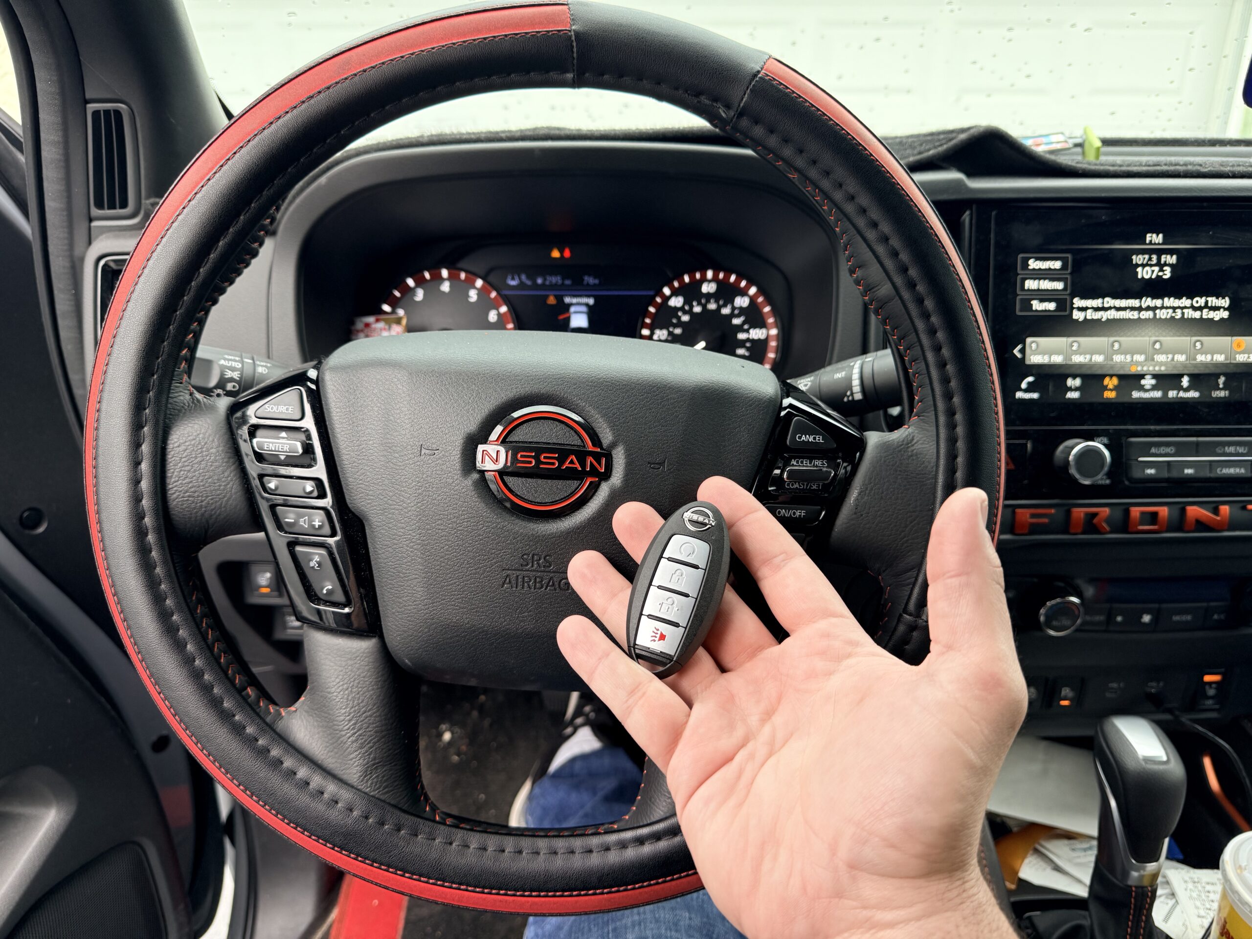 Nissan vehicle interior during mobile key fob replacement service