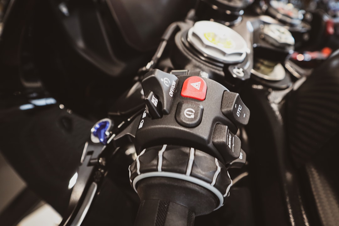 Close-up of motorcycle handlebars and ignition for motorcycle key service